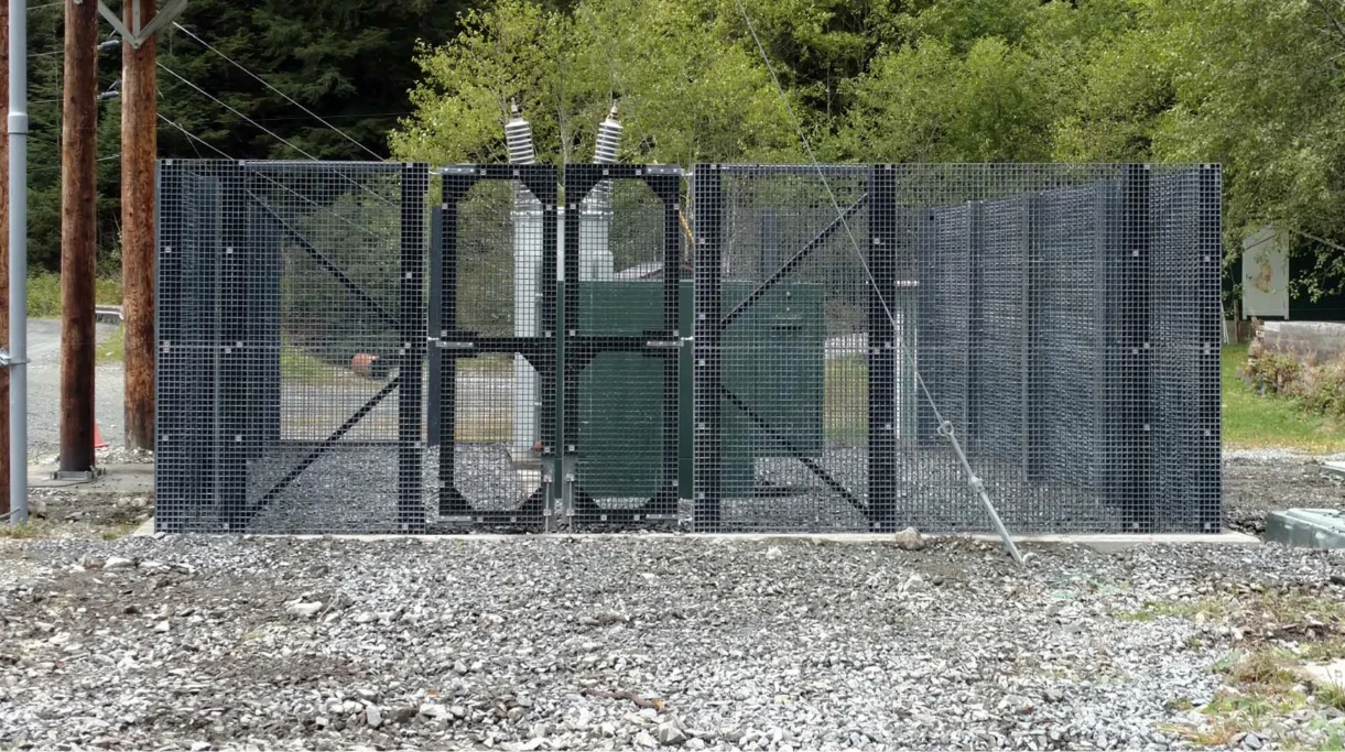 Voltros fiberglass grating fence enclosing electrical equipment at a utility site