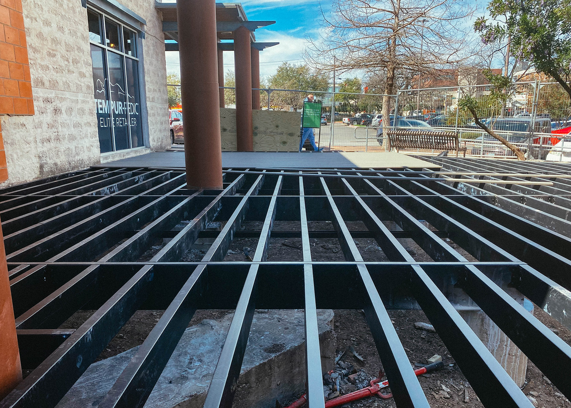 Commercial deck project utilizing steel framing for fire safety and structural integrity. 