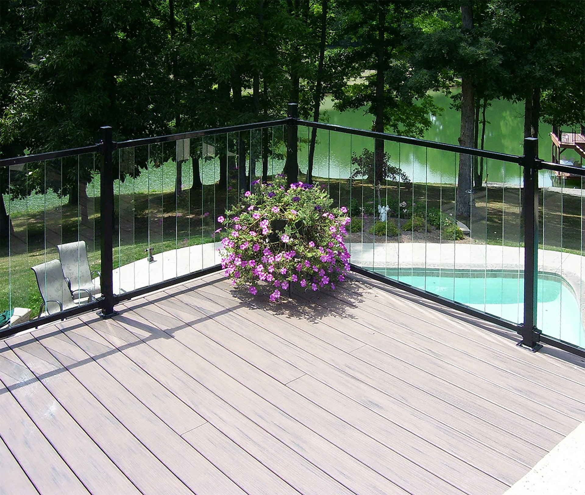 Patio with glass baluster railings offering unobstructed views.