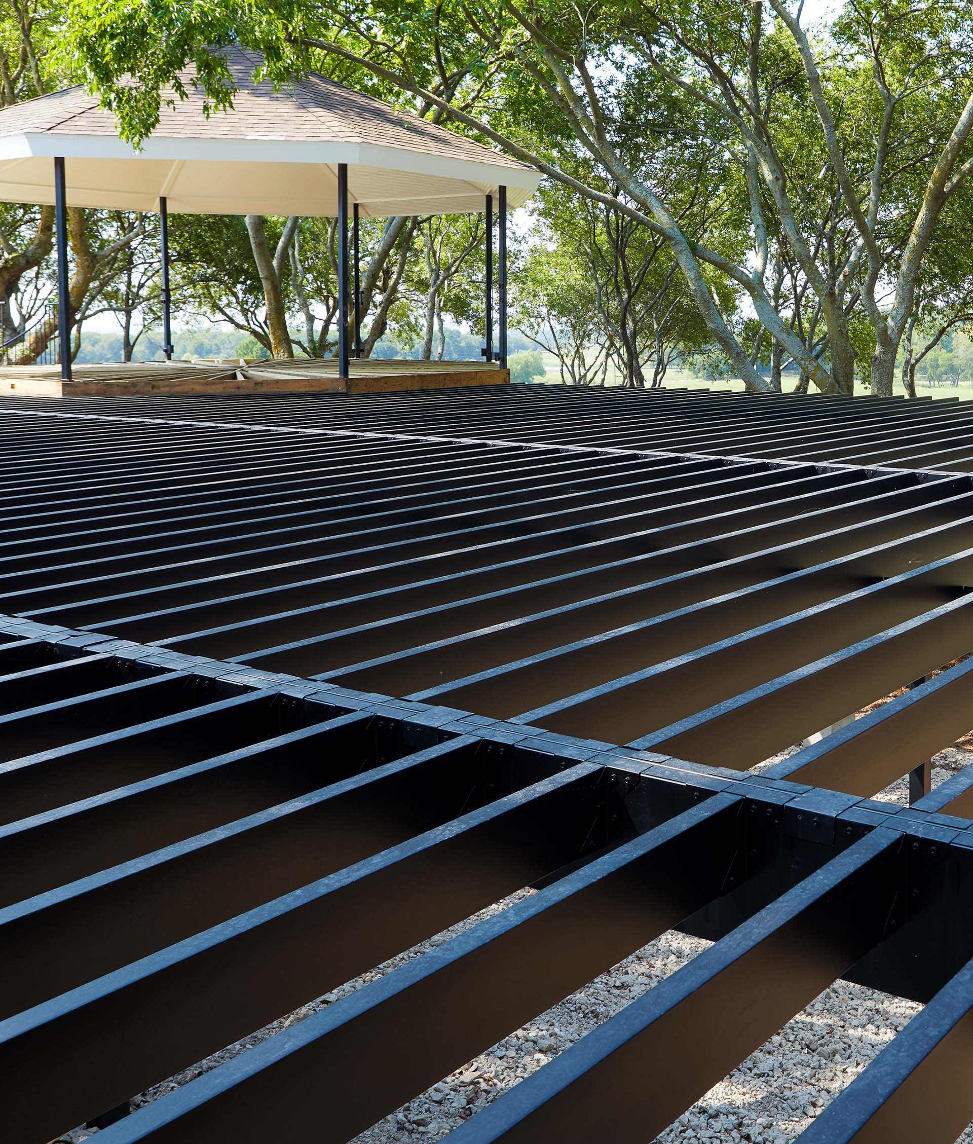 Steel deck framing set up for a lake house deck with scenic water views.