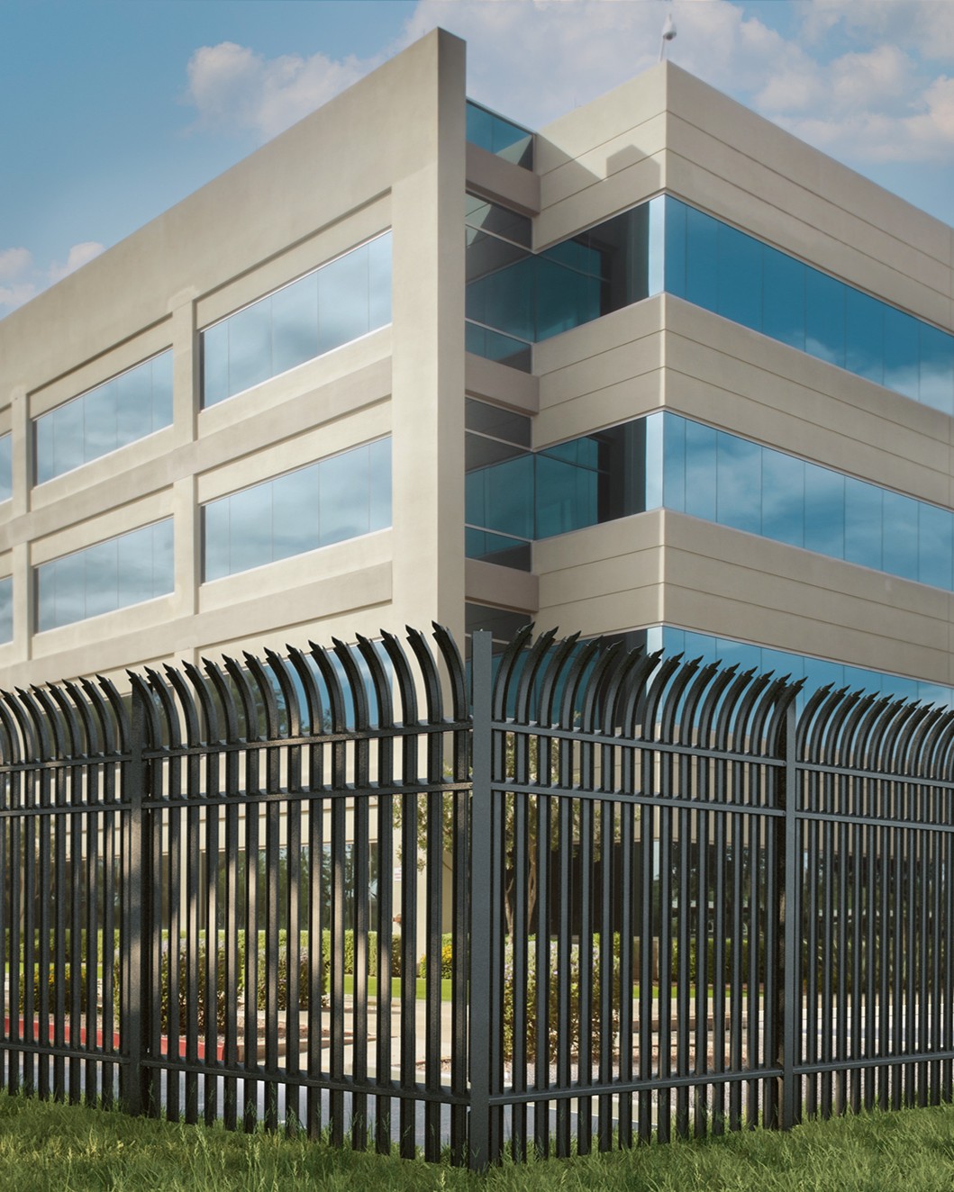 Anti-climb high-security fence with curved pales protecting a commercial building perimeter.