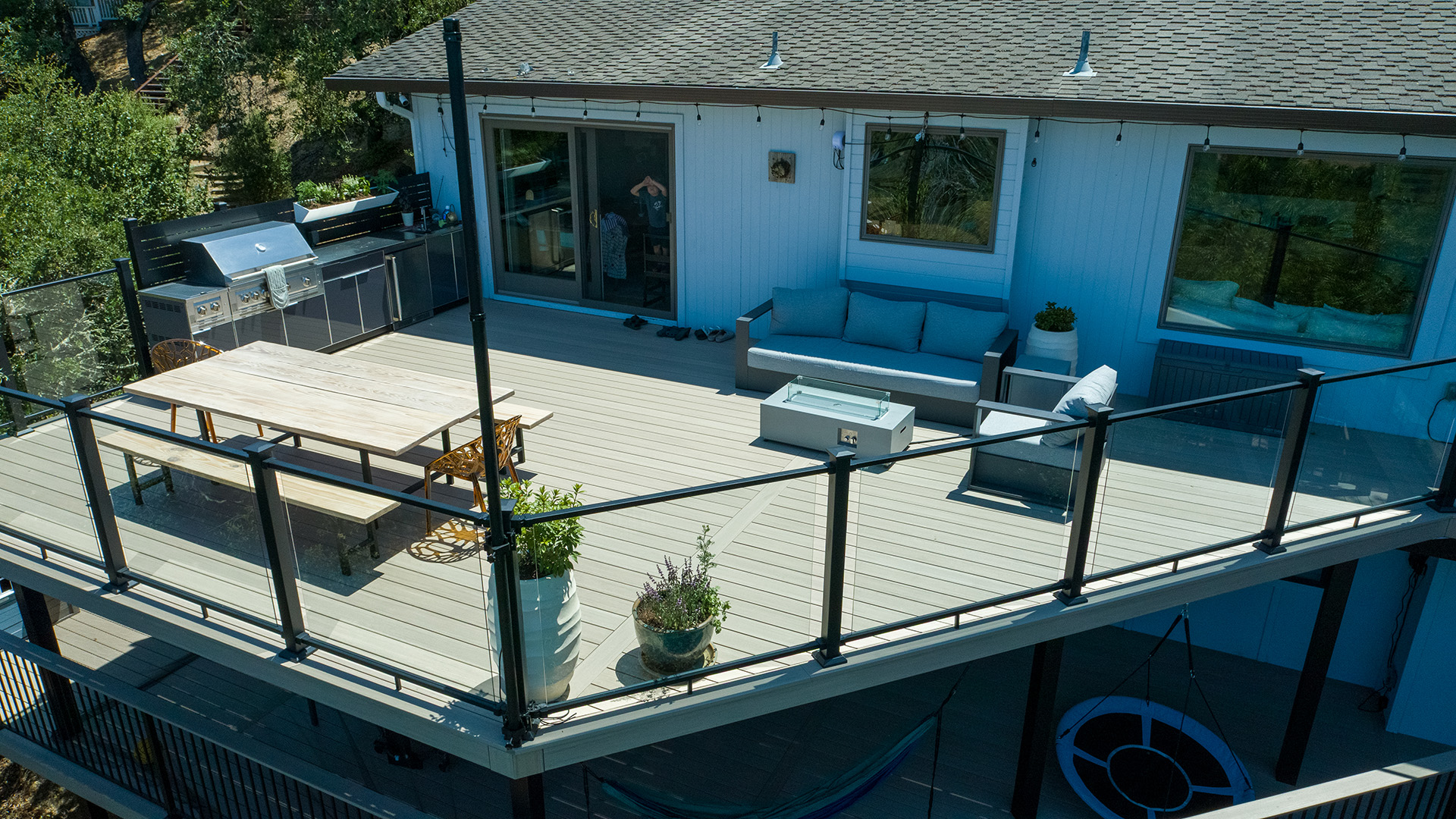 Elevated outdoor living space featuring Fortress railing and composite decking.