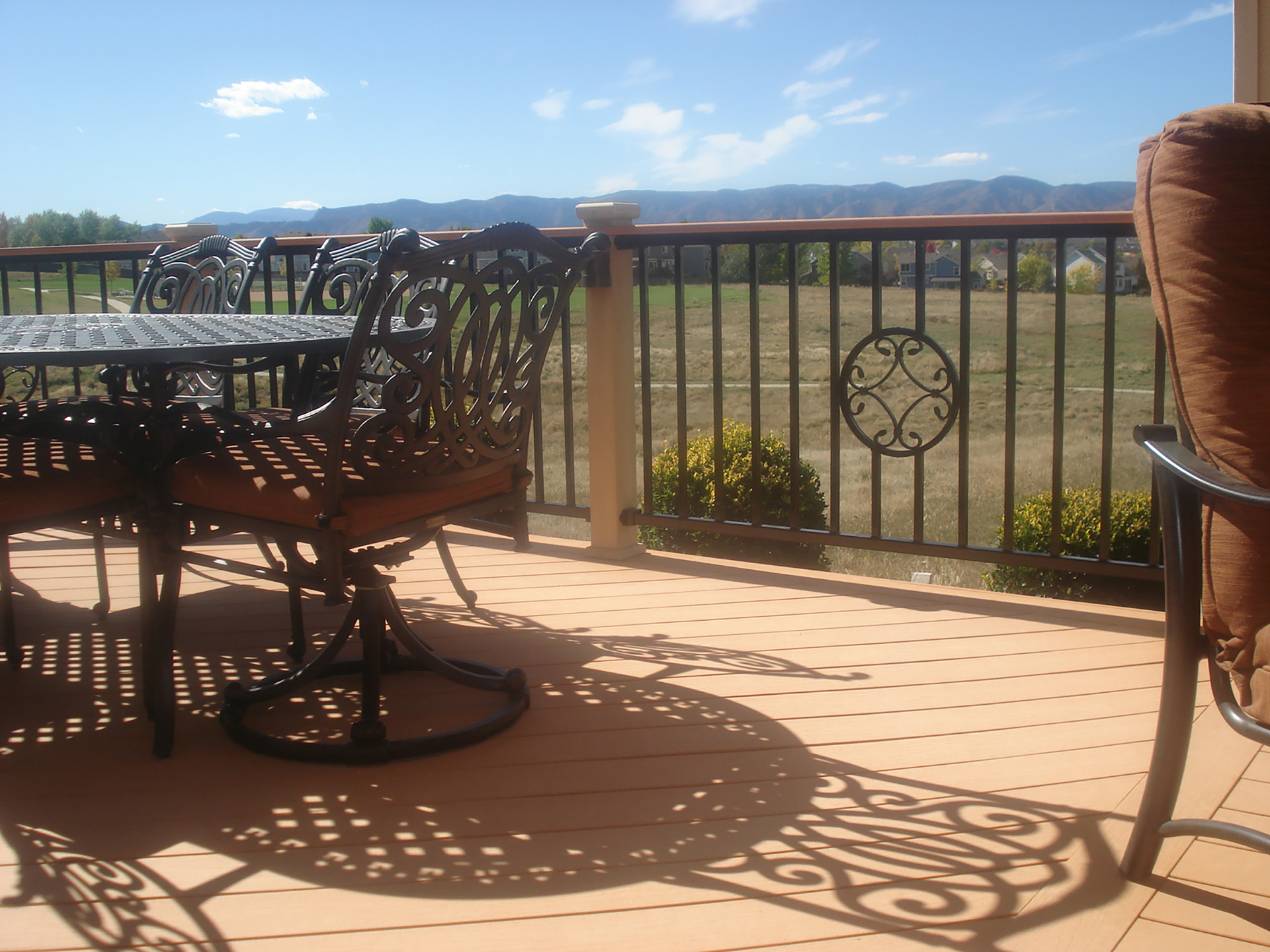 Ornamental steel deck railing adds style to elevated outdoor space.