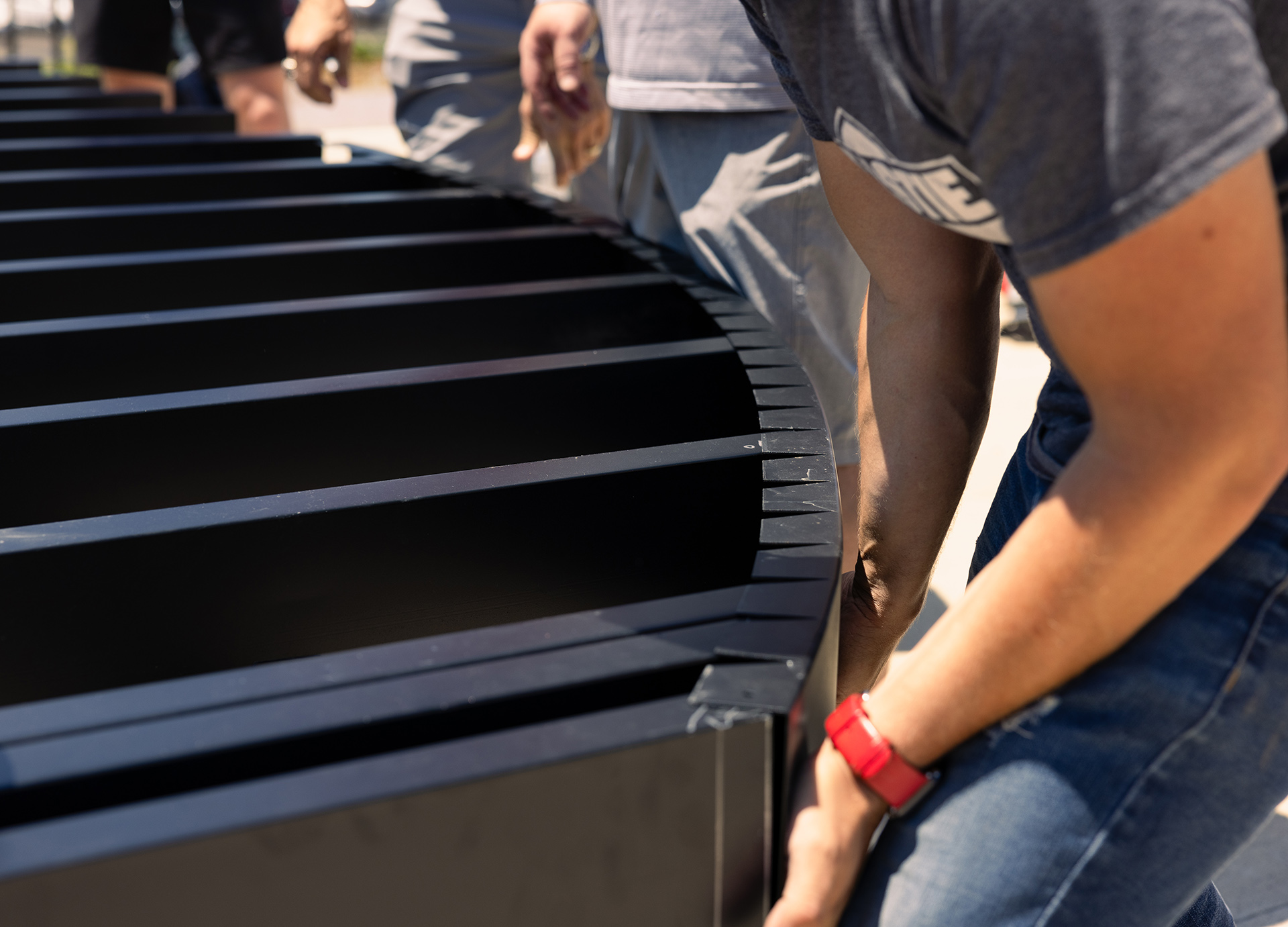 Close-up view of a construction worker assembling steel deck framing.