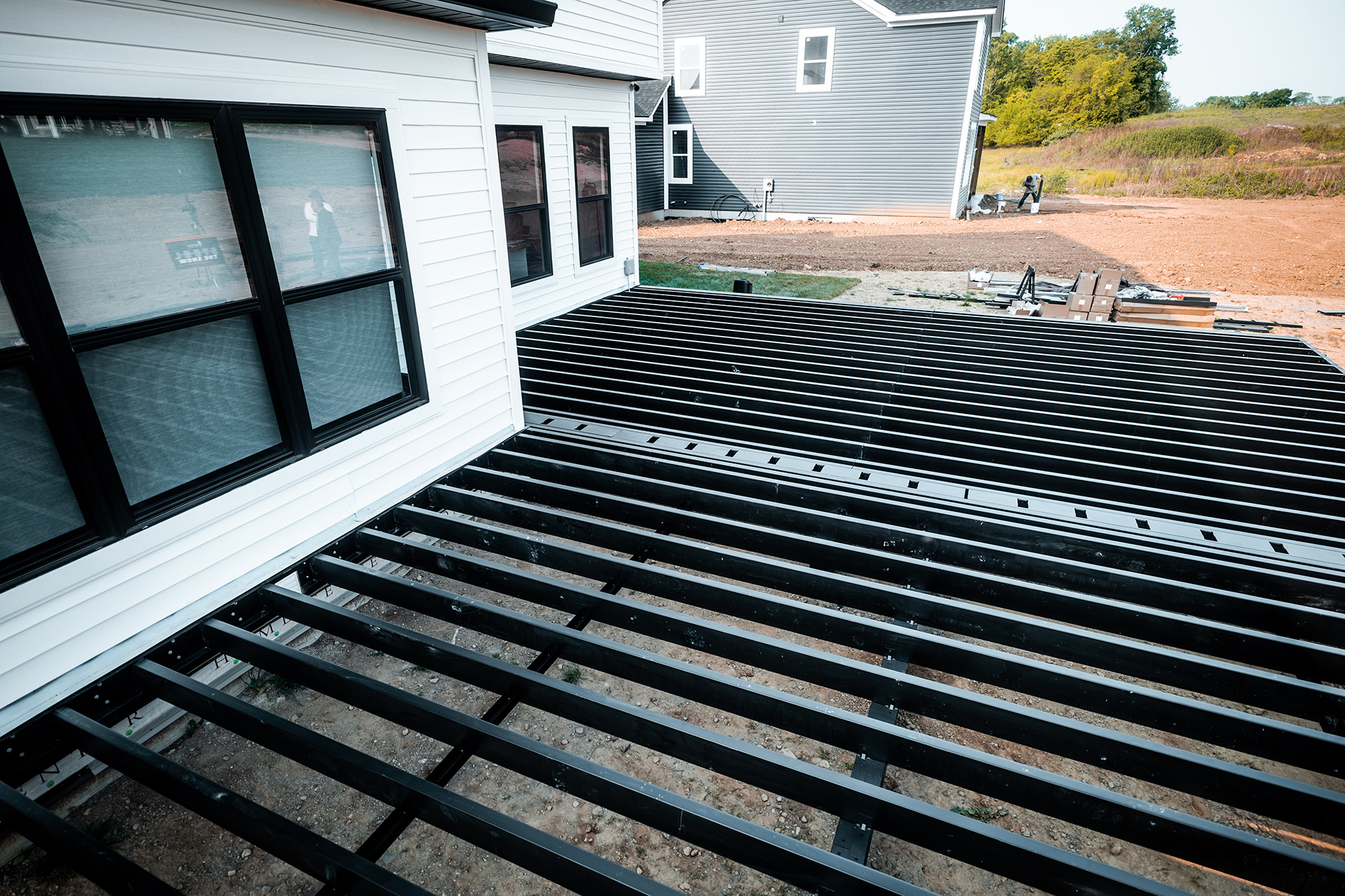 Steel deck framing setup for a large outdoor deck, providing a robust and fire-resistant foundation.