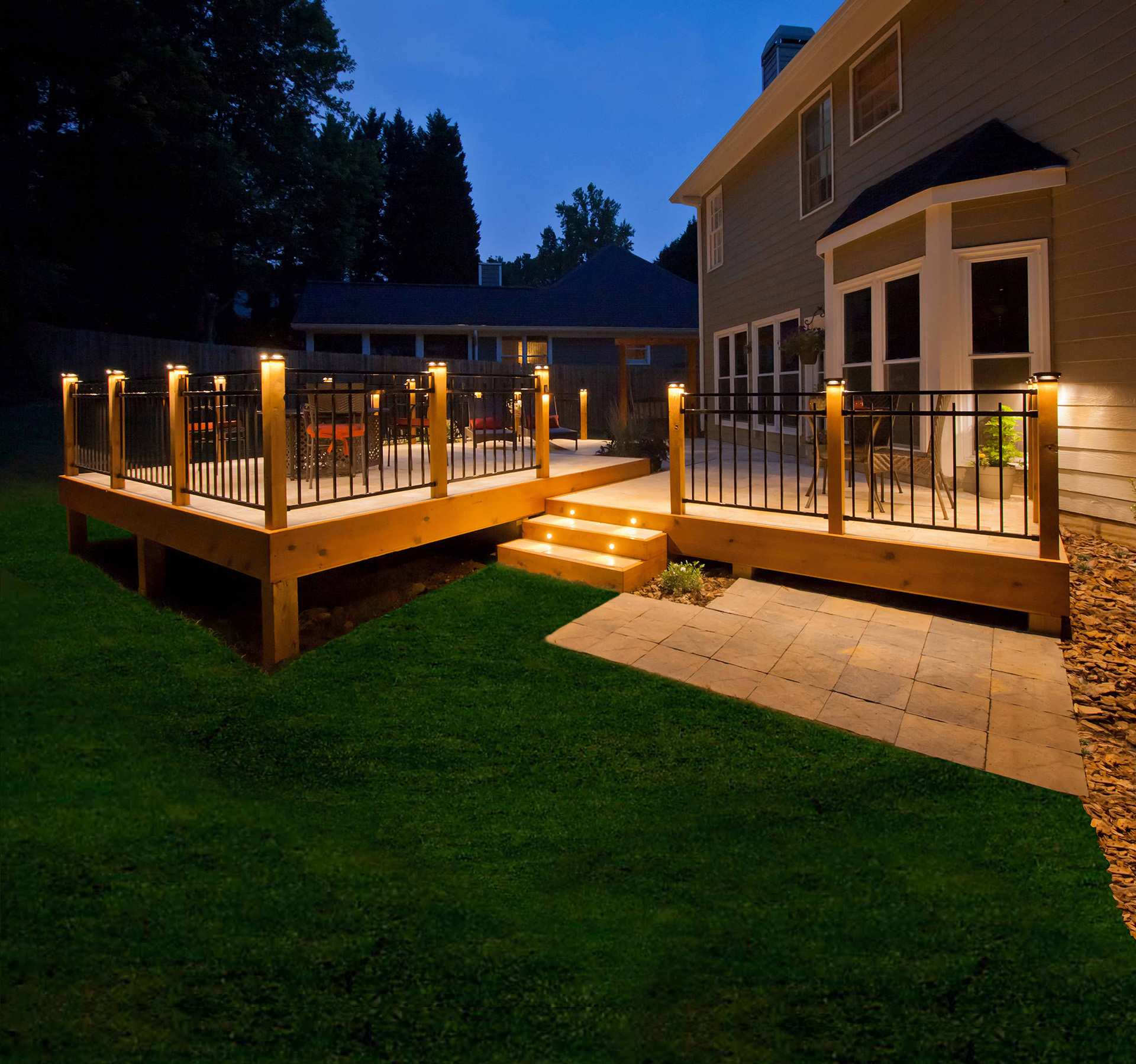 Outdoor deck lit with pot and surface mount lights.
