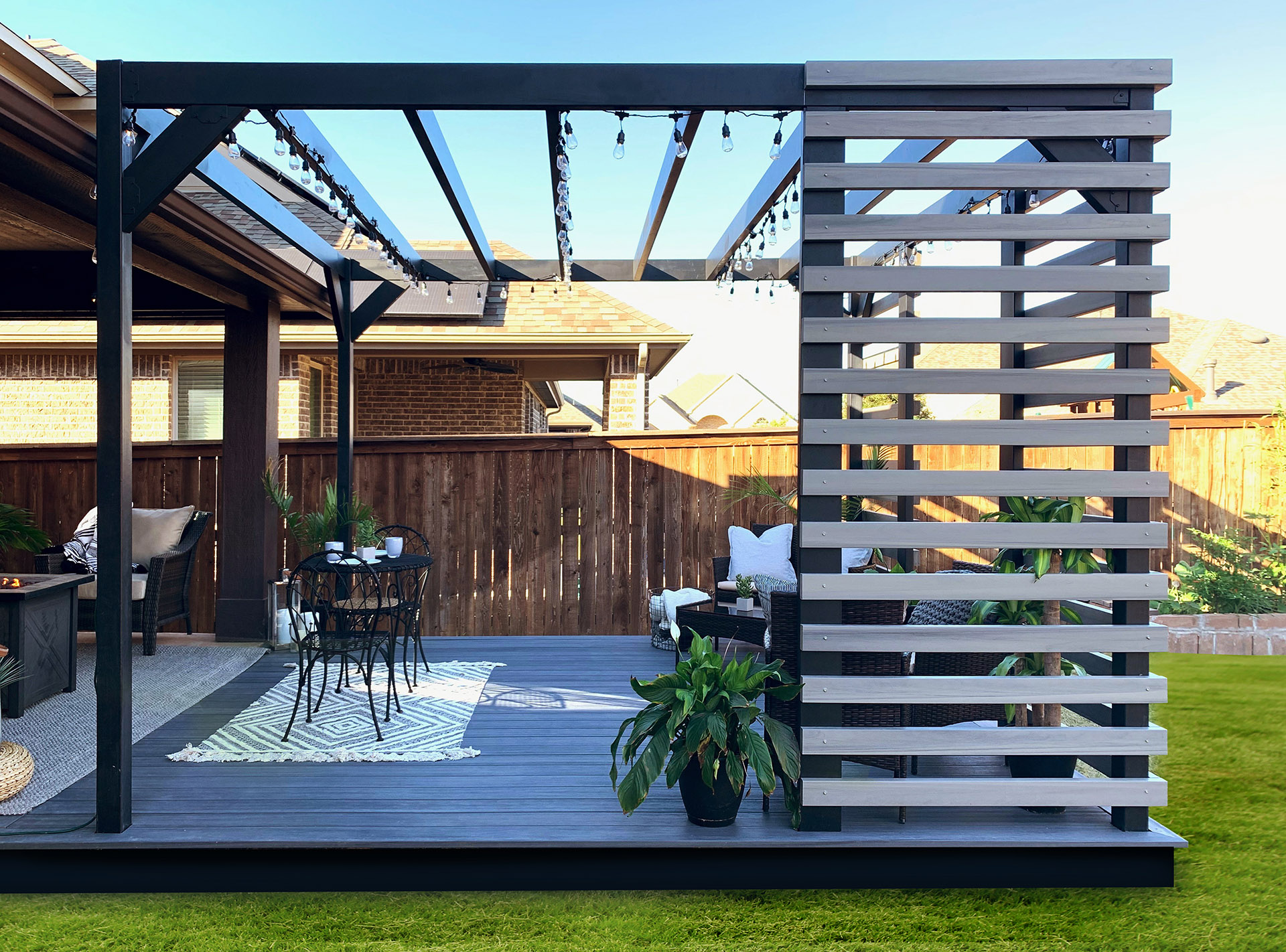 A backyard featuring a fire-resistant pergola and stylish patio furniture, ideal for outdoor relaxation and gatherings.