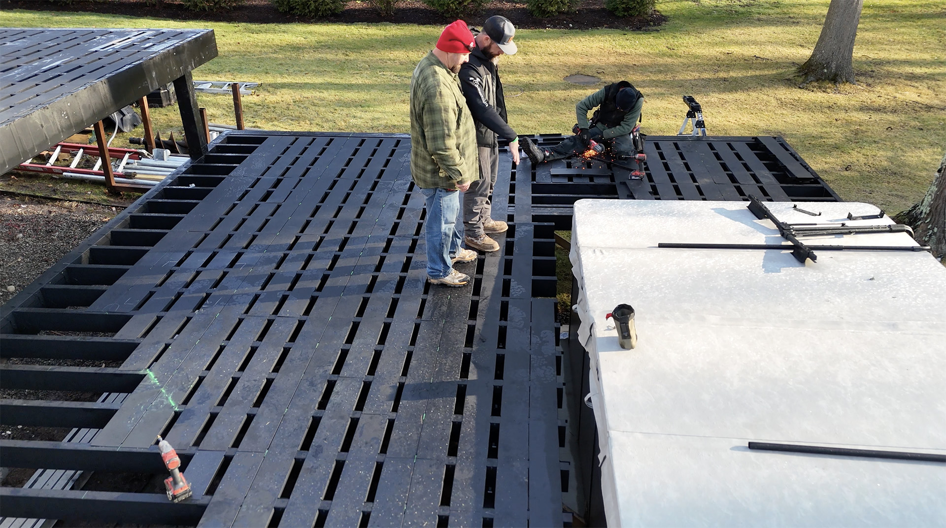 Contractors assembling a steel frame deck using Fortress' Evolution system.